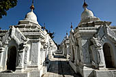 Myanmar - Mandalay, Kuthodaw Pagoda. 729 white pitaka pagodas contain the Tipitaka, the sacred texts of Theravada Buddhism. 